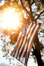 sunlight glowing on an American flag 