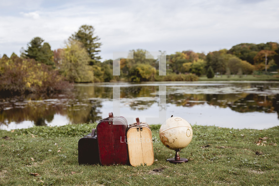 suitcases and a globe 