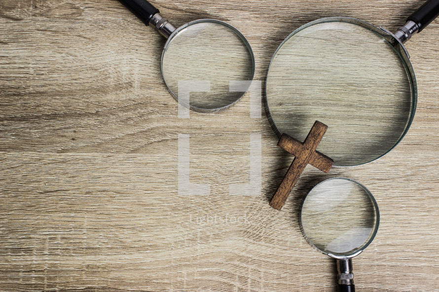 magnifying glasses and cross 