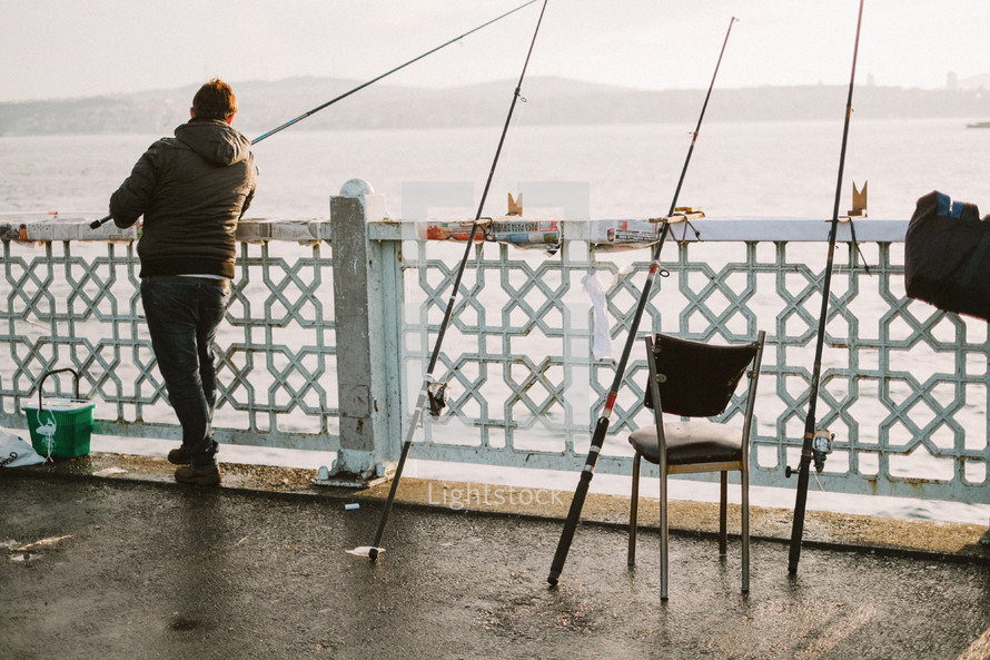 fisherman on a pier 