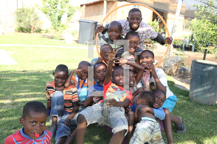 A missionary surrounded by kids in South Africa