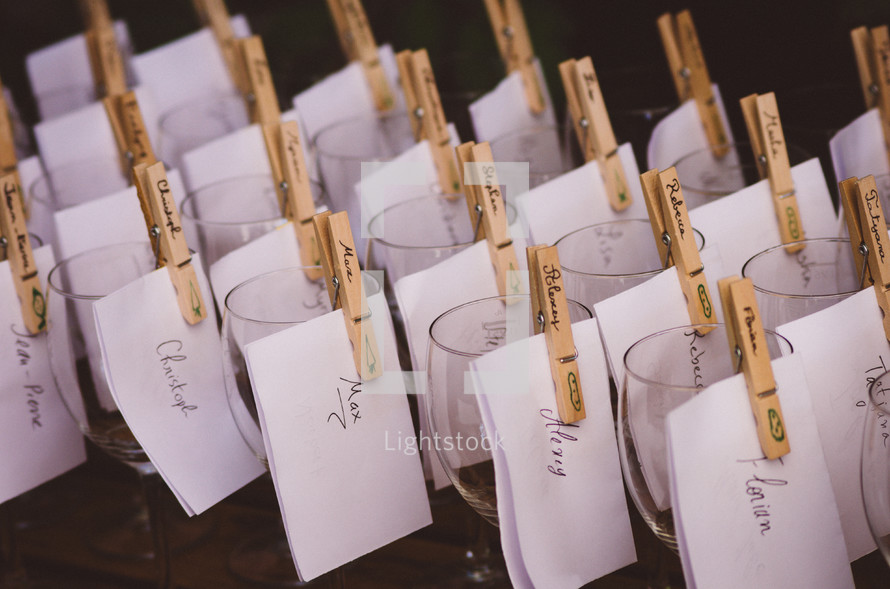 names on wine glasses at a wedding reception 