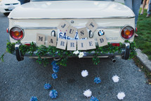 just married sign on the back of a car