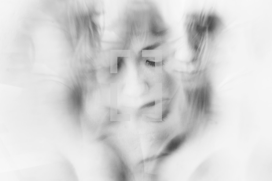 Image of a woman, taken through a crystal