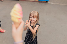 excited child getting an ice cream cone 