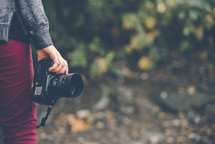 person standing holding a camera 