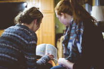 two women reading scripture 