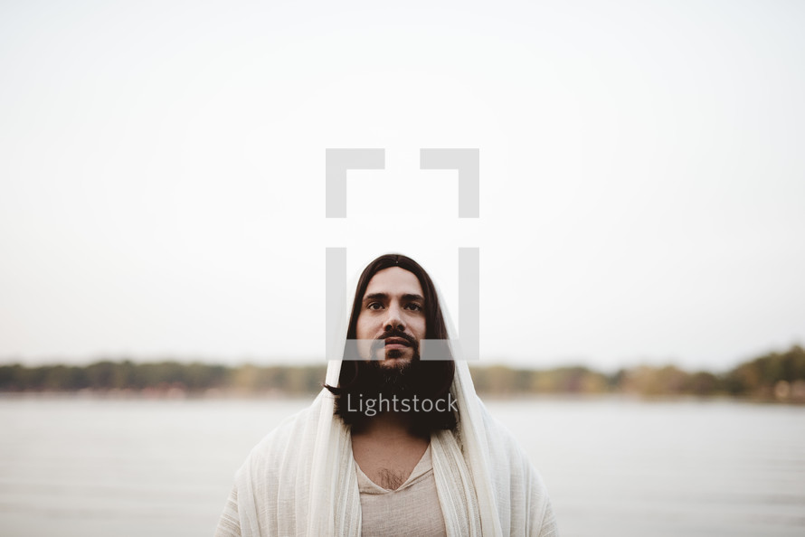 Jesus standing in front of a sea 