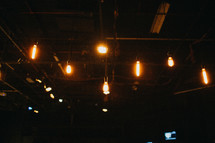 lightbulbs hanging from rafters 