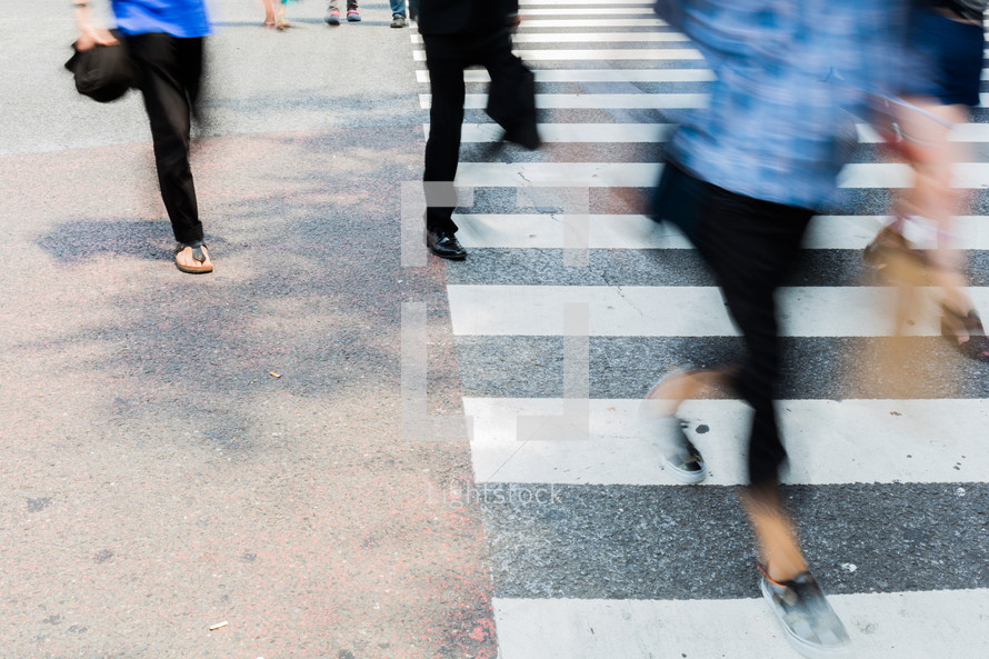 people crossing a crosswalk 