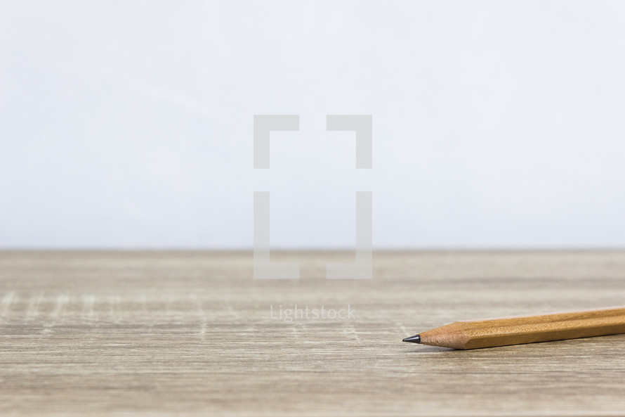 sharpened pencil on a desk 