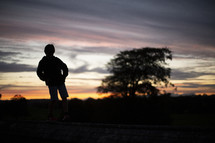 silhouette of a child at sunset 