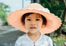 little girl in a sunhat 