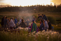 group praying outdoors 