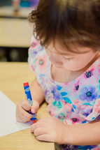 toddler coloring with crayons 