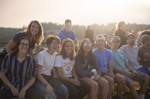 group of smiling teens and young adults 