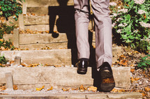 a man walking up stone steps 