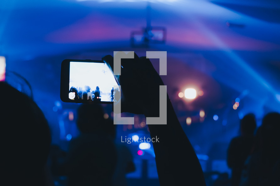 taking a picture of a concert with a cellphone 