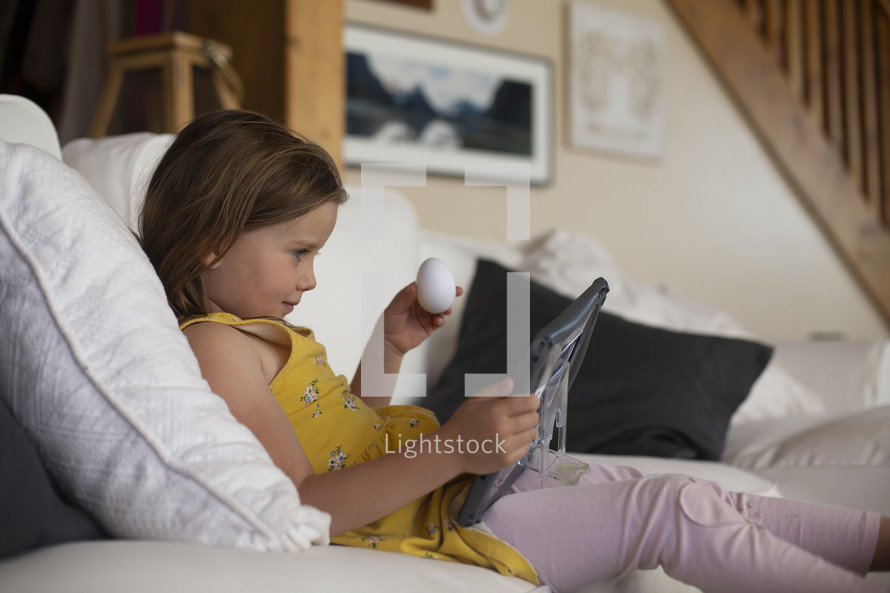 a child using a tablet for online learning 