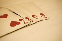 Love written using numbers on playing cards