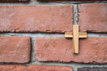 cross on red bricks 