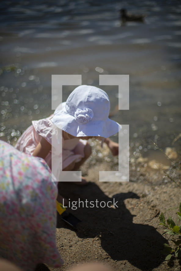toddler playing on a beach 