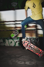 teen boy doing a trick on a skateboard 