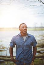 portrait of an African American male standing outdoors 