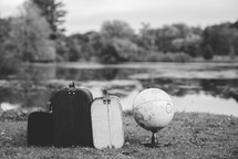suitcases and a globe 