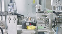 Advanced robotic machine manufacturing parts in an automated assembly line