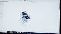 Footage of Industrial Engineer using CAD Program designing parts