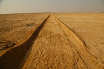 dirt road through a desert 
