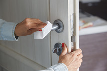 cleaning a doorknob 