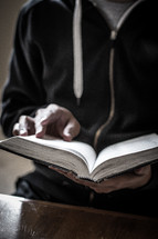 man reading a Bible