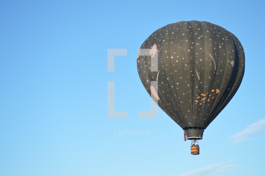 hot air balloon against a blue sky 