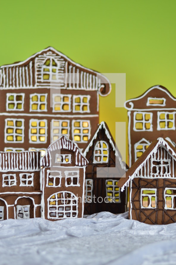 gingerbread village in front of yellow and green