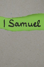 torn open kraft paper over green paper with the name of the book 1 Samuel 