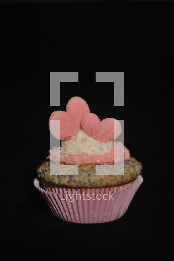 Cupcake for my sweetheart. 
cupcake, in love, love, Valentine, couple, Valentine's Day, February, 14, enamored, amorous, fond, lovestruck, twosome, relationship, romance, heart, hearts, delicious, tasty, yummy, pink, rose, celebration, invitation, cupcakes, joy, food, eat, eating, sweet, festivity, invite, present, gift, homemade, home made, home-made, self, self-made, bake, baking, baker, pastry, cook, confectioner, coffee cake, celebrate, celebrating, feast, enjoy, relish, savor, appreciate, creme, topping, happy