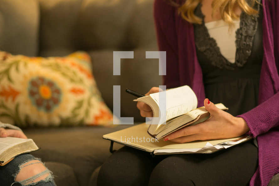 Bible study in a woman's lap.