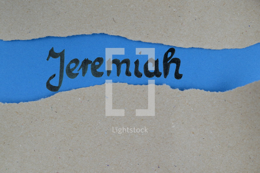 Jeremiah - torn open kraft paper over blue paper with the name of the prophetic book  Jeremiah