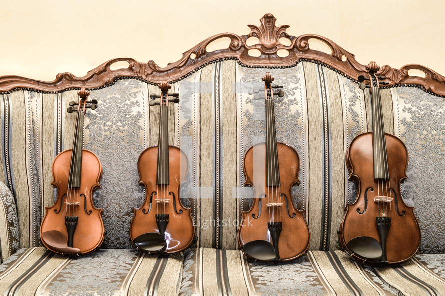 violins on a couch 