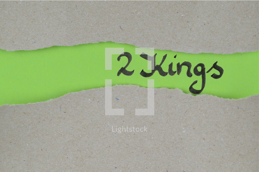 Title 2 Kings - torn open kraft paper over green paper with the name of the book 2 Kings