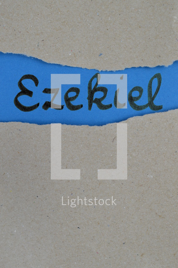 Ezekiel - torn open kraft paper over blue paper with the name of the prophetic book  Ezekiel