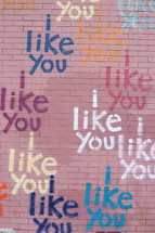 words I LIKE YOU painted on a brick wall