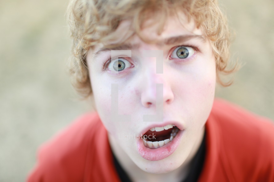teen boy making a silly face