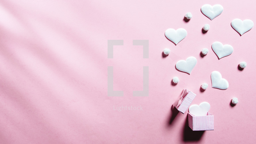 Pink background with white hearts 