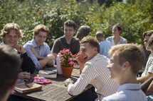 Group of young men and women talking and laughing