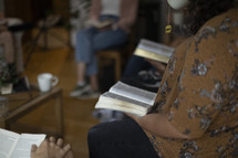 Woman drinking tea at group Bible study