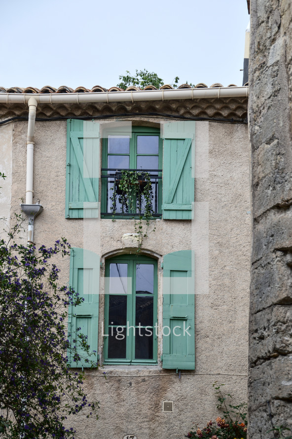 windows with green shutters 