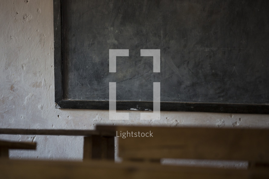 blank chalkboard in a school house 